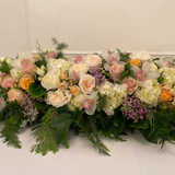 Floral arrangement with a variety of flowers on a white background